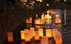 Lanterns floated in the pond at Como Park at dusk Sunday night. ] JEFF WHEELER &#xef; jeff.wheeler@startribune.com The annual Japanese Lantern Lightin