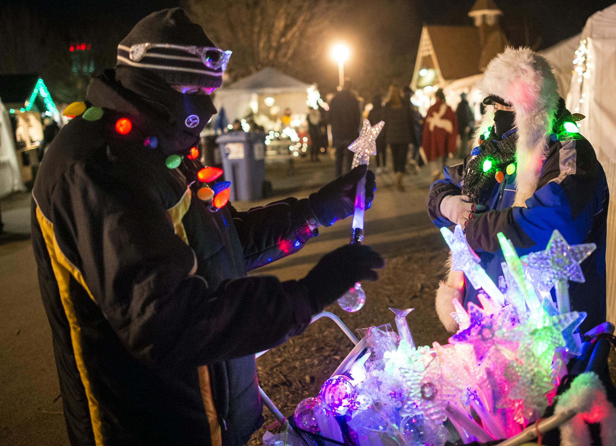 Mark and Amy Heyman of Woodbury sold light toys for Sweet Dreams Concessions on Friday night at Holidazzle.