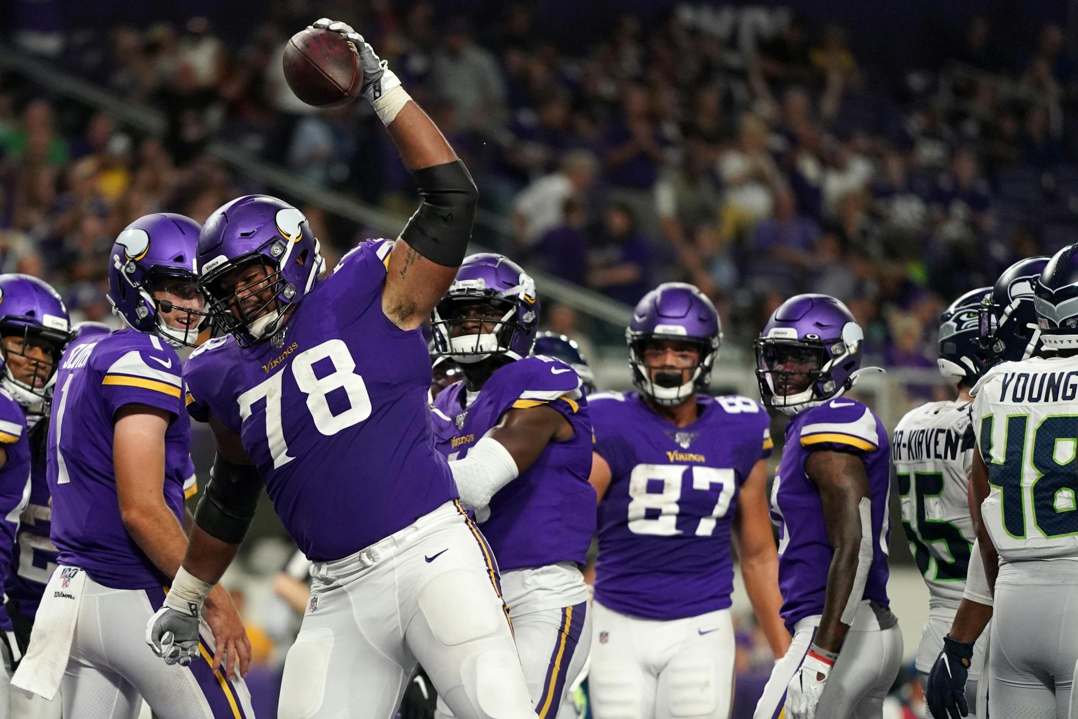 Minnesota Vikings offensive guard Dakota Dozier (78) spiked the ball in the end zone after Vikings running back Khari Blasingame (48) scored a touchdown in the second half.