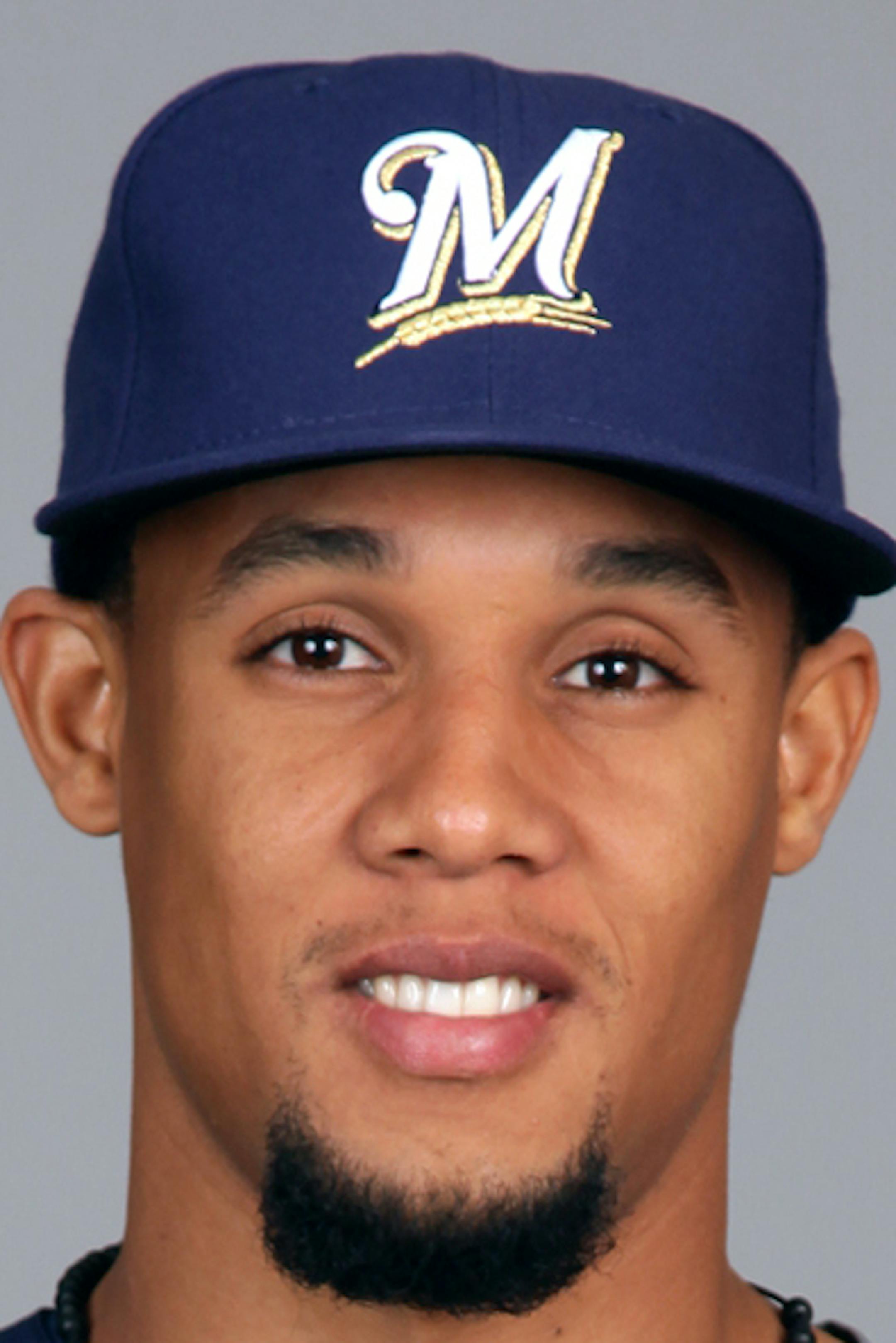 PHOENIX - FEBRUARY 17: Carlos Gomez #27 of the Milwaukee Brewers poses during Photo Day on Sunday, February 17, 2013 at Maryvale Baseball Park in Phoenix, Arizona. (Photo by Jason Wise/MLB Photos via Getty Images) *** Local Caption *** Carlos Gomez ORG XMIT: 159448170