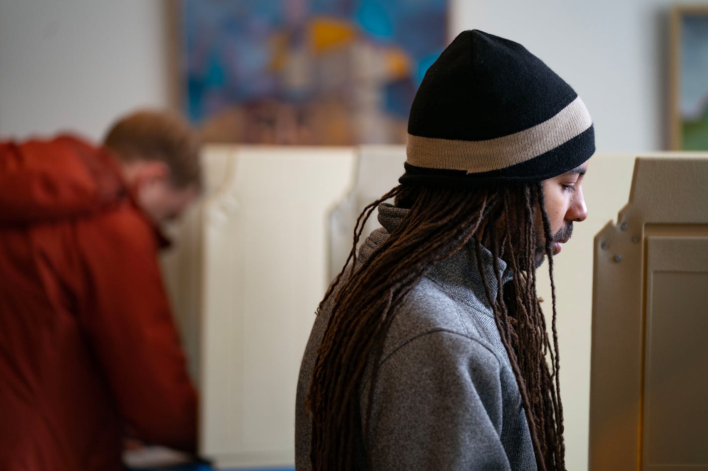 Quinlan McWilliams fills out his ballot Tuesday, Nov. 8, 2022 at Westminster Presbyterian Church in Minneapolis. ]