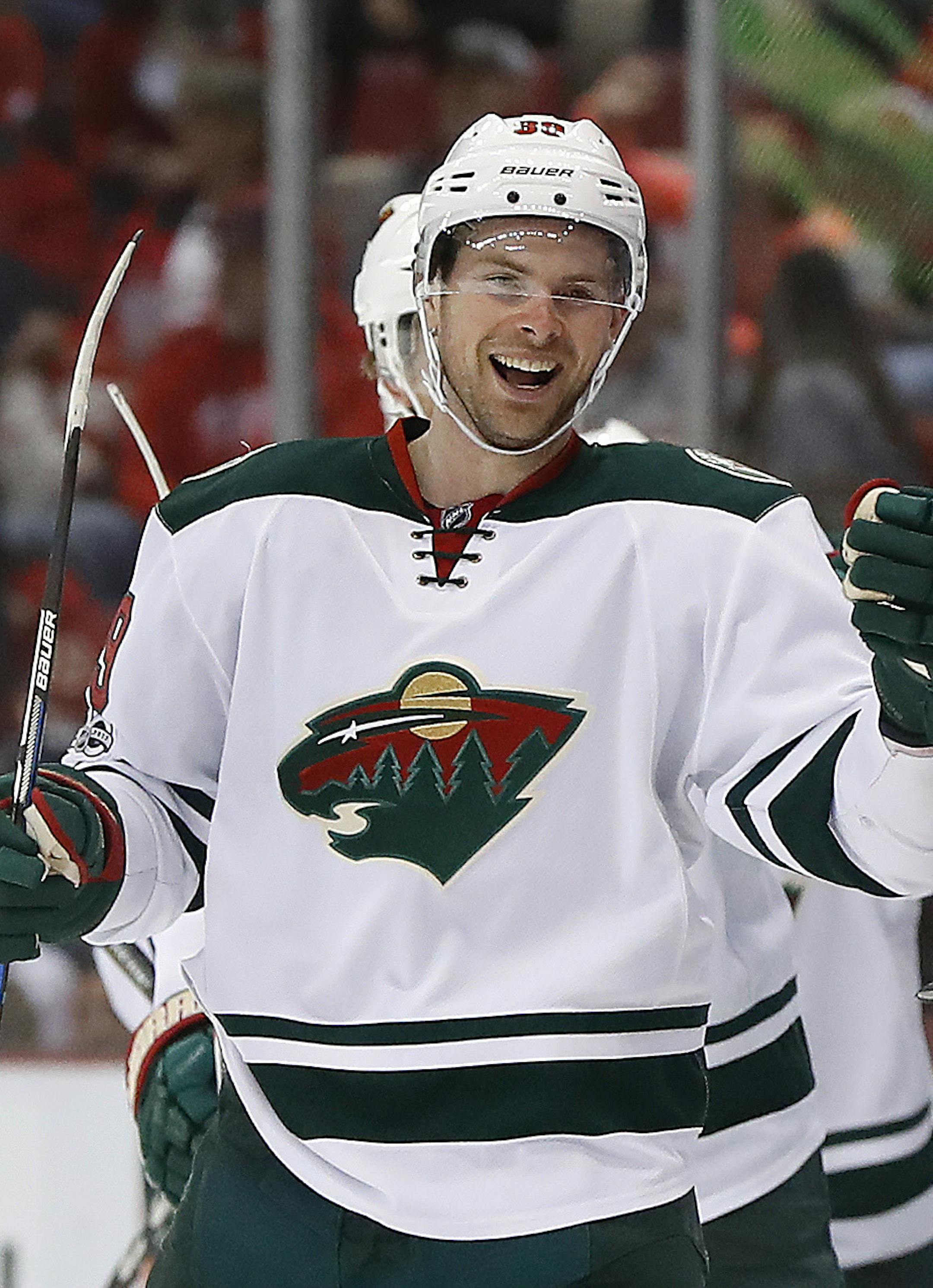 Minnesota Wild defenseman Nate Prosser celebrates his goal against the Detroit Red Wings in the second period of an NHL hockey game Sunday, March 26, 2017, in Detroit. (AP Photo/Paul Sancya)
