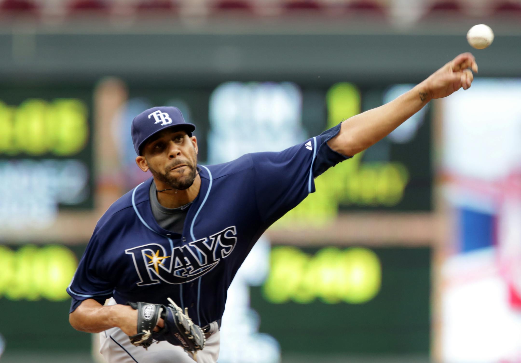 Tampa Bay Rays starting pitcher David Price throws against the Minnesota Twins in the first inning of a baseball game, Saturday, July 19, 2014, in Minneapolis. (AP Photo/Jim Mone)