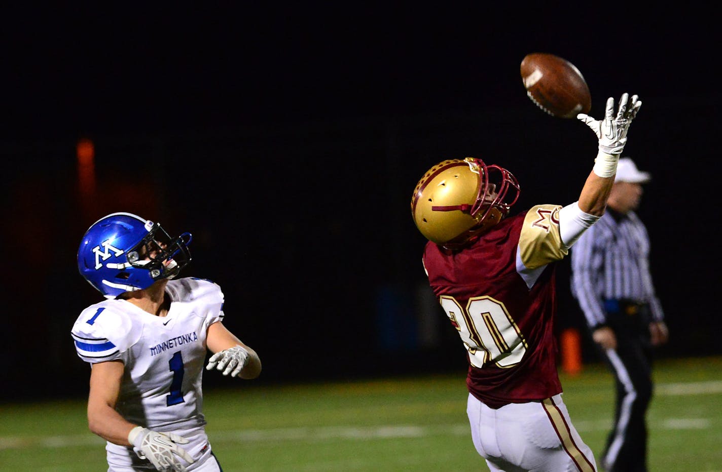 Maple Grove #30 Jake Engelken blocked a pass intended for Minnetonka #1Braden Sikes in the fourth quarter. Maple Grove players celebrated their win. Maple Grove beat Minnetonka 14 to 9 and goes on to the state tournament. Friday, November 1, 2013. ] GLEN STUBBE * gstubbe@startribune.com