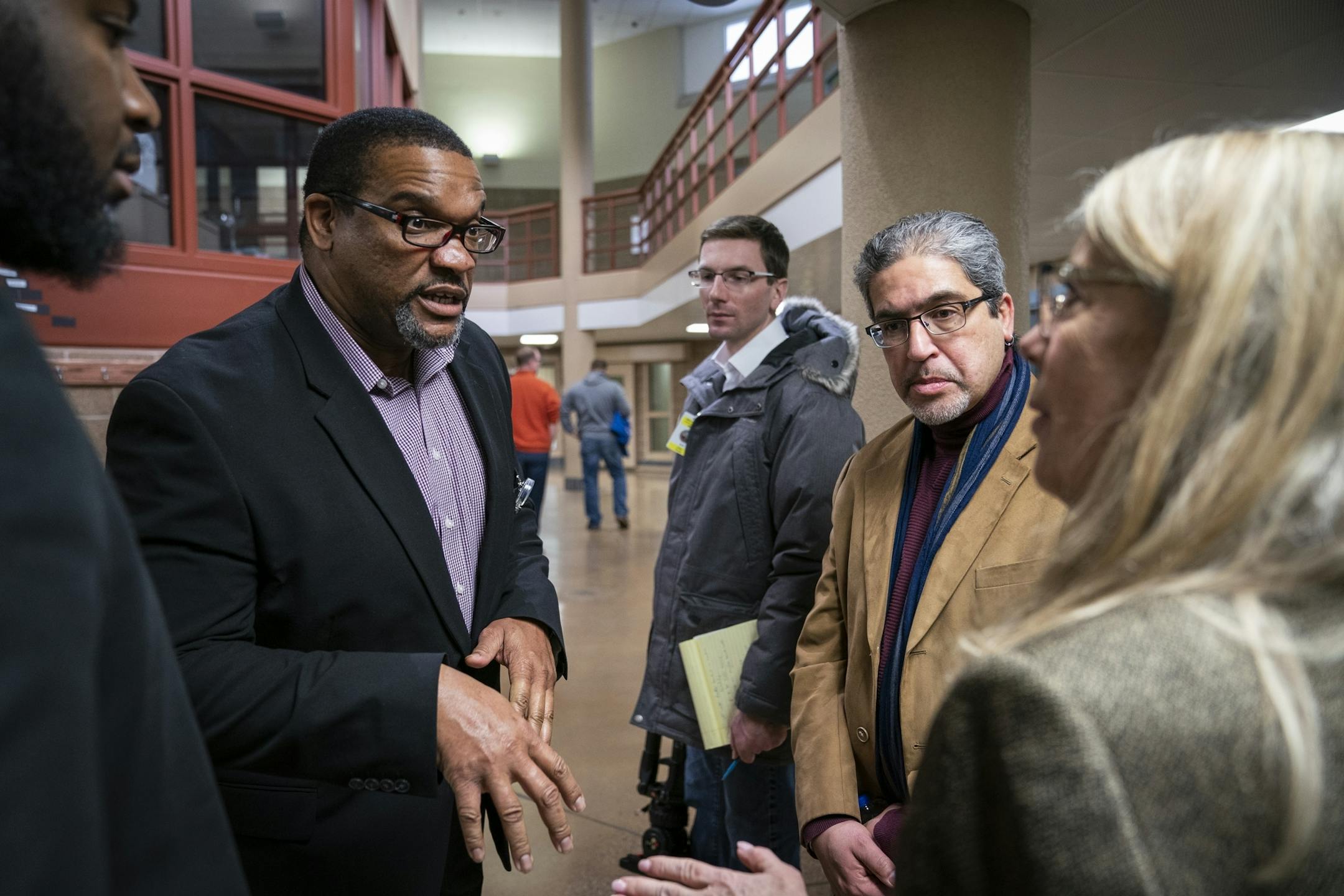 Warden Eddie Miles, left, talked with Rep. Carlos Mariani and Rep. Michelle Christensen during their tour of Stillwater prison.