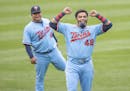 Minnesota Twins players including Nelson Cruz, right, and Willians Astudillo, left, wore the #42 to honor Jackie Robinson Day, Thursday, April 15, 202