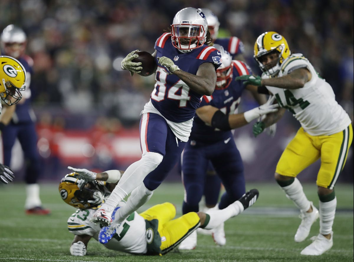 New England Patriots wide receiver Cordarrelle Patterson (84) gains yardage as a running back during the first half of an NFL football game against th
