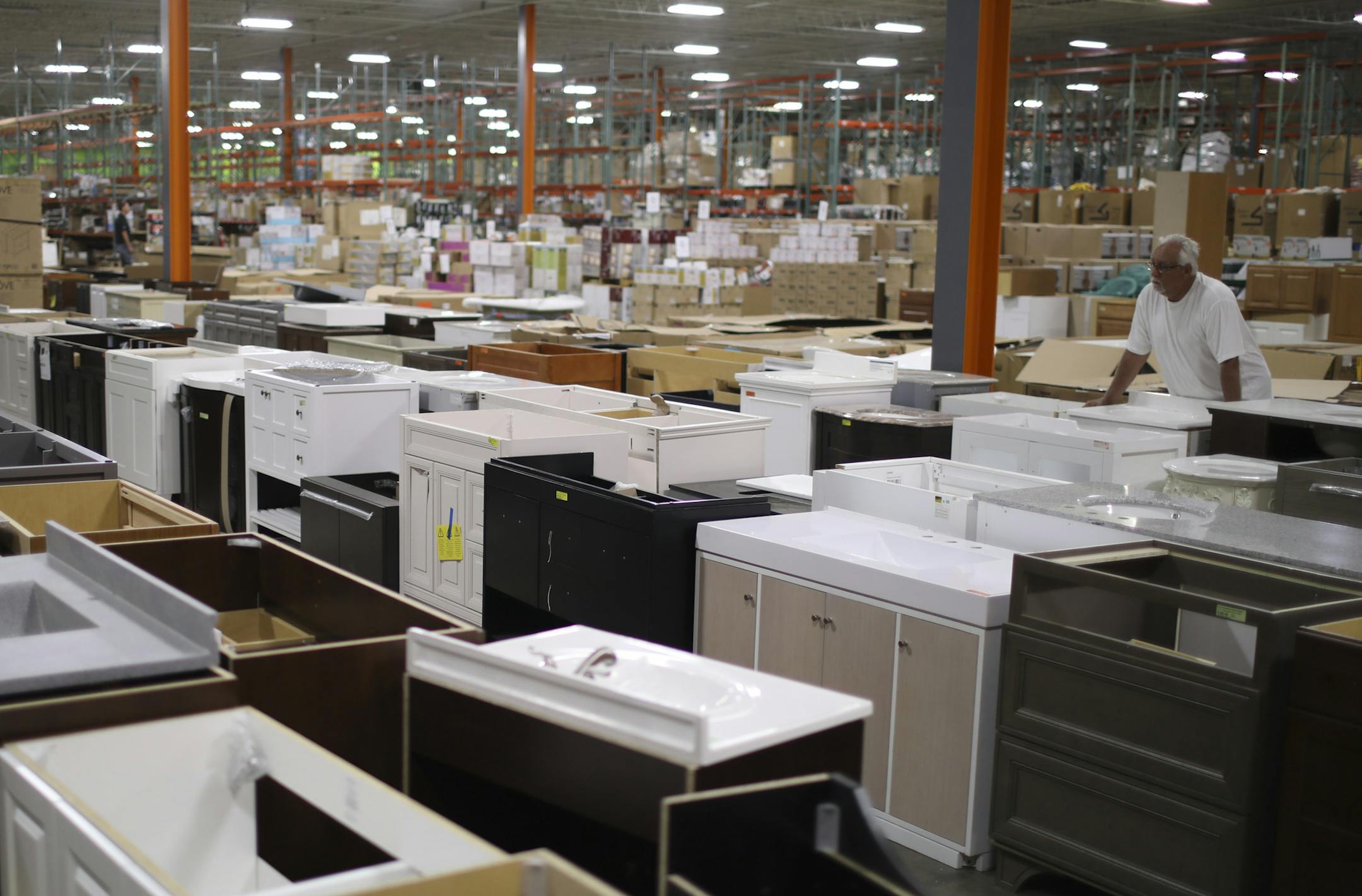 Rows of bathroom vanities in MN Home Outlet's warehouse location. ] JEFF WHEELER &#xef; jeff.wheeler@startribune.com MN Home Outlet in Burnsville opened in 2015 as the go-to place for the home remodeler on a tight budget. They claim to be the only retailer in the Twin Cities taking returns and overstocks from major home improvement retailers and reselling them at reduced prices. MN Home Outlet owner Jimmy Busika was photographed in his vast Burnsville warehouse location Tuesday afternoon, July 2