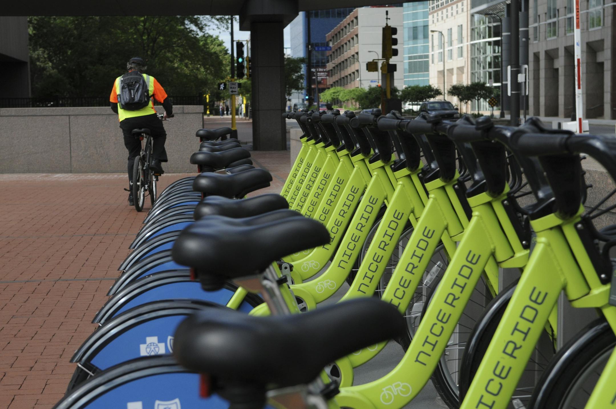 The Bike Walk to Work Day celebration was held this morning at Hennepin County Government Center Plaza . These Nice Ride bikes are all lined up waiting for riders on the plaza.