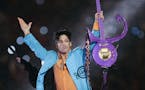 In this Feb. 4, 2007 file photo, Prince performs during the halftime show of Super Bowl XLI.