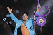 In this Feb. 4, 2007 file photo, Prince performs during the halftime show of Super Bowl XLI.