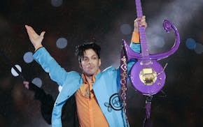 In this Feb. 4, 2007 file photo, Prince performs during the halftime show of Super Bowl XLI.