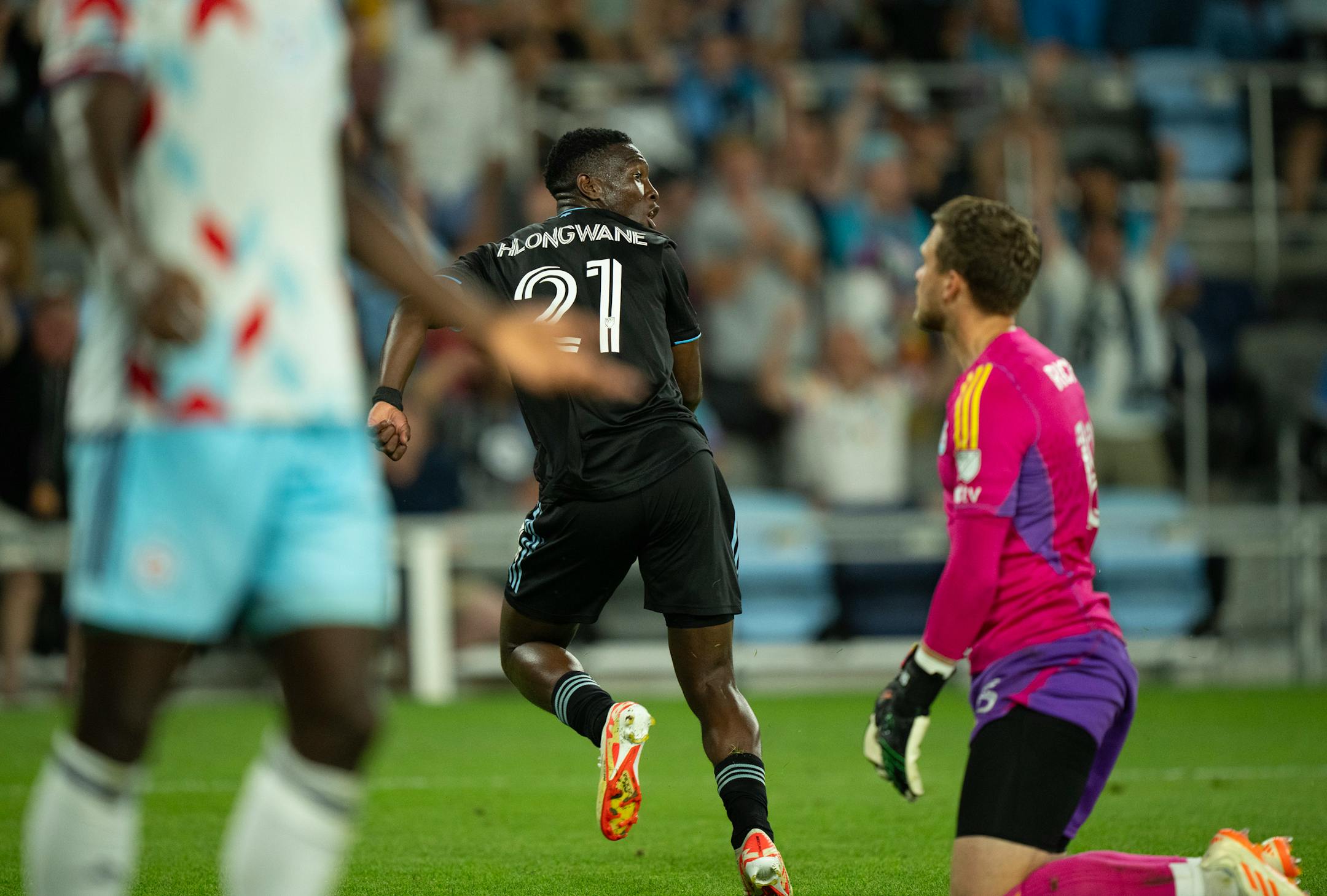 Minnesota United forward Bongokuhle Hlongwane (21) began to celebrate after his first goal on Chicago Fire goalkeeper Spencer Richey, right, in the second half find the mark.