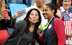 Lynx player Maya Moore poses for selfies with fans after team USA won their 6th consecutive gold medal. The Lynx's Lindsay Whalen scored 17 points off
