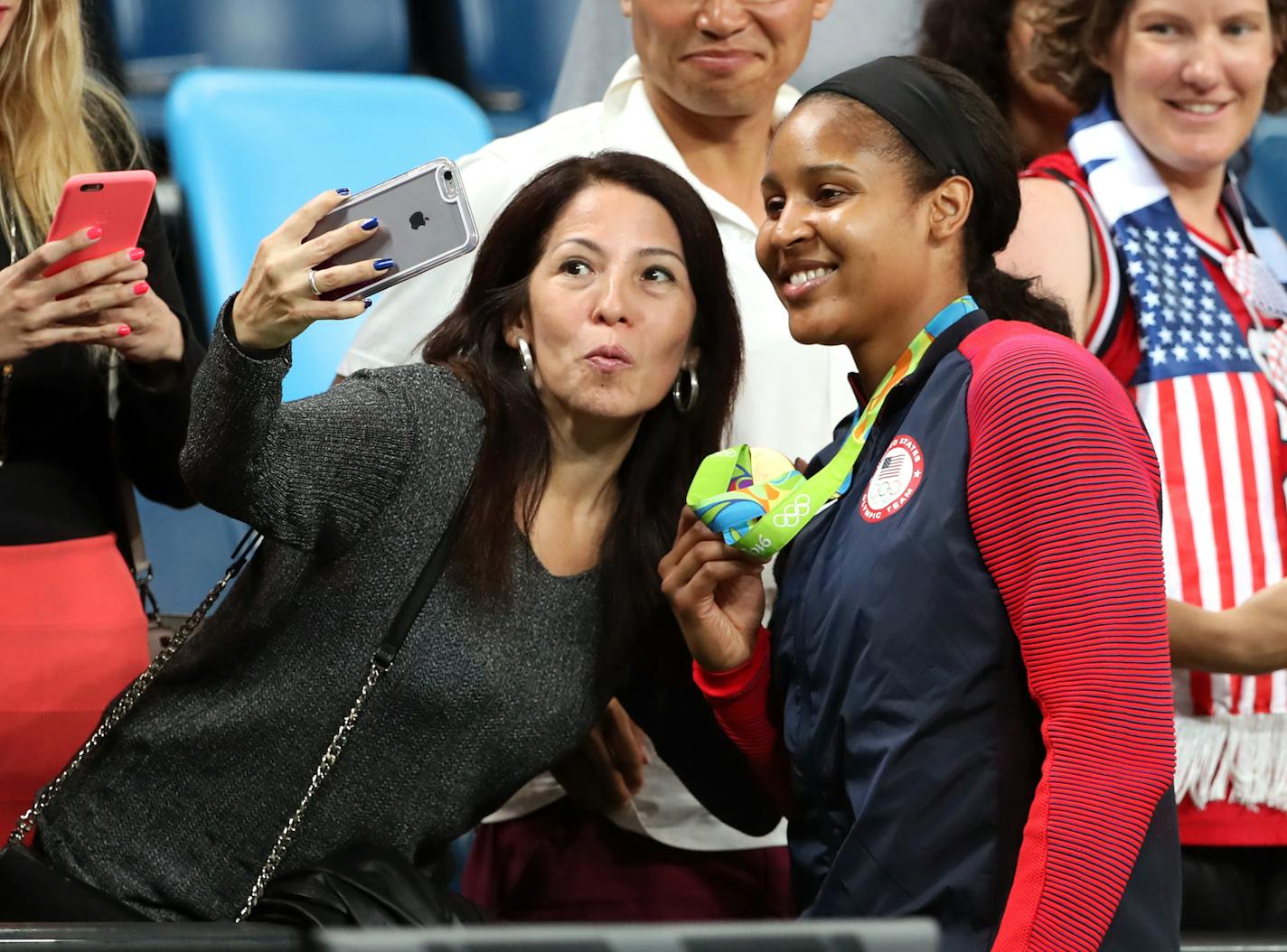 Lynx player Maya Moore poses for selfies with fans after team USA won their 6th consecutive gold medal. The Lynx's Lindsay Whalen scored 17 points off the bench in the victory, giving the U.S. women's basketball team its sixth consecutive gold medal. ] 2016 Summer Olympic Games - Rio Brazil brian.peterson@startribune.com Rio de Janeiro, Brazil - 08/19/2016