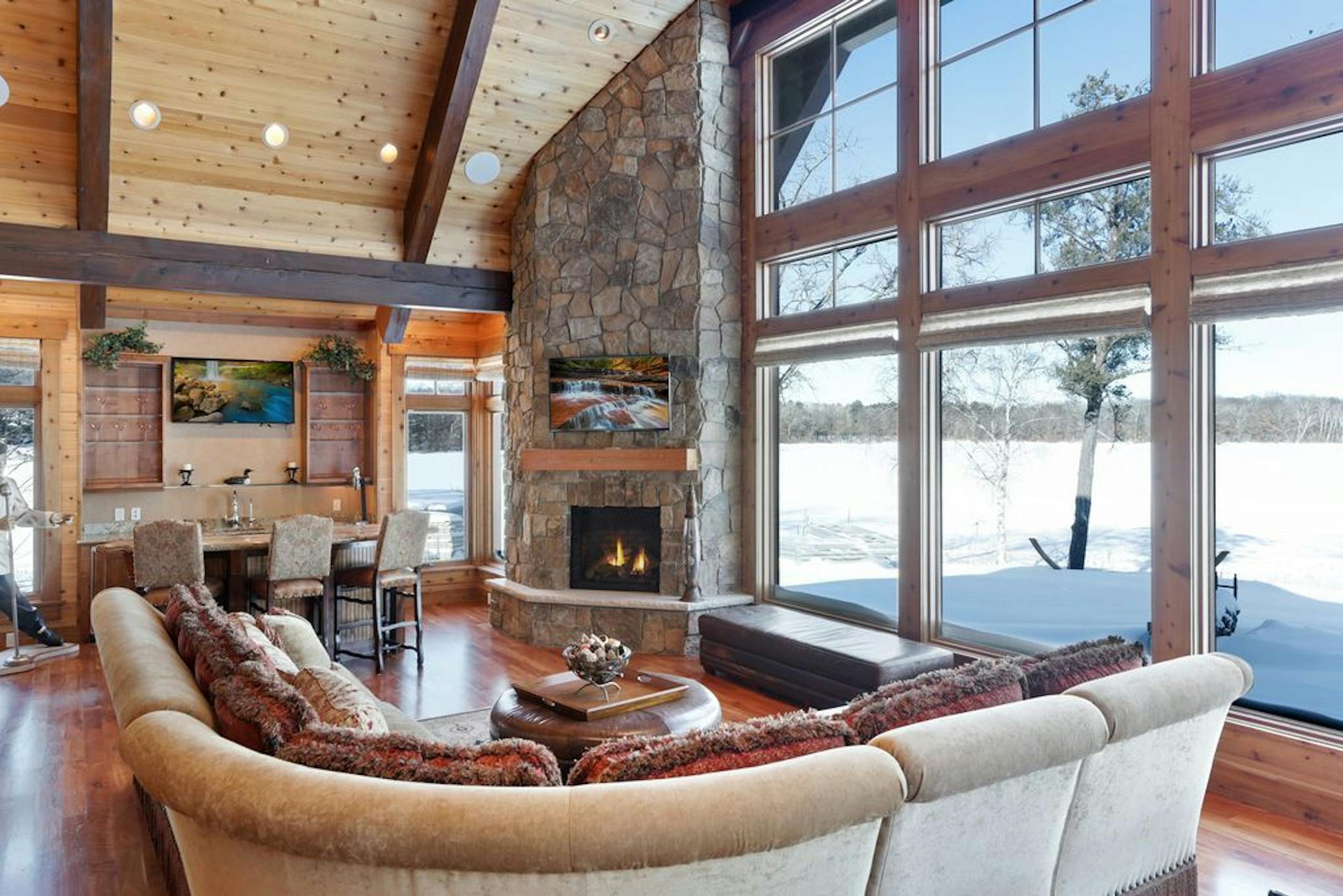 A wall of windows overlooks the lake.