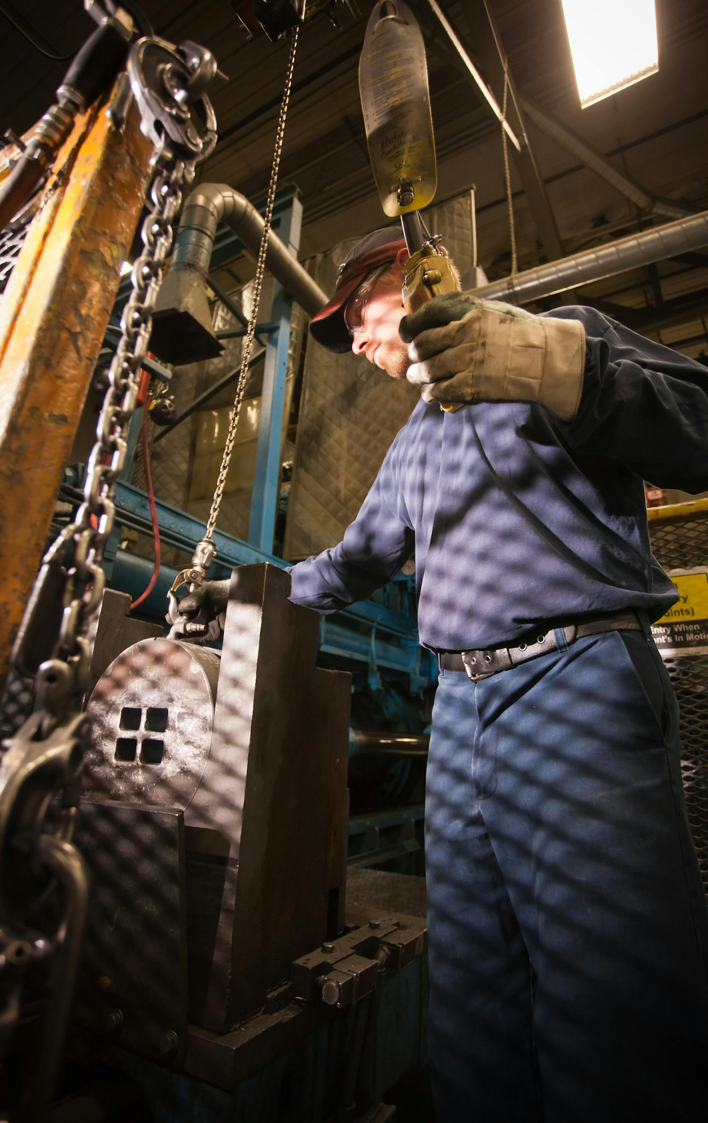 An extrusion press operator at Alexandria Industries.