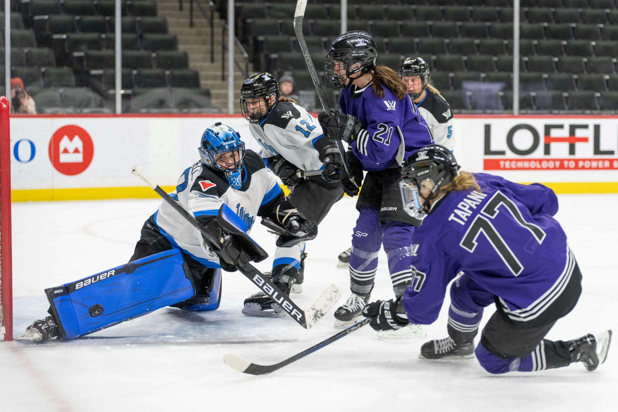 Toronto goalie Kristen Campbell (50) makes a pad save as Minnesota forward Liz Schepers (21) and forward Susanna Tapani (77) await a rebound in the second period between Minnesota and Toronto of the PWHL at the Xcel Energy Center in St. Paul on Wednesday, Jan. 10, 2024. Photo by Matt Blewett, Special to Star Tribune matt@mattebphoto.com