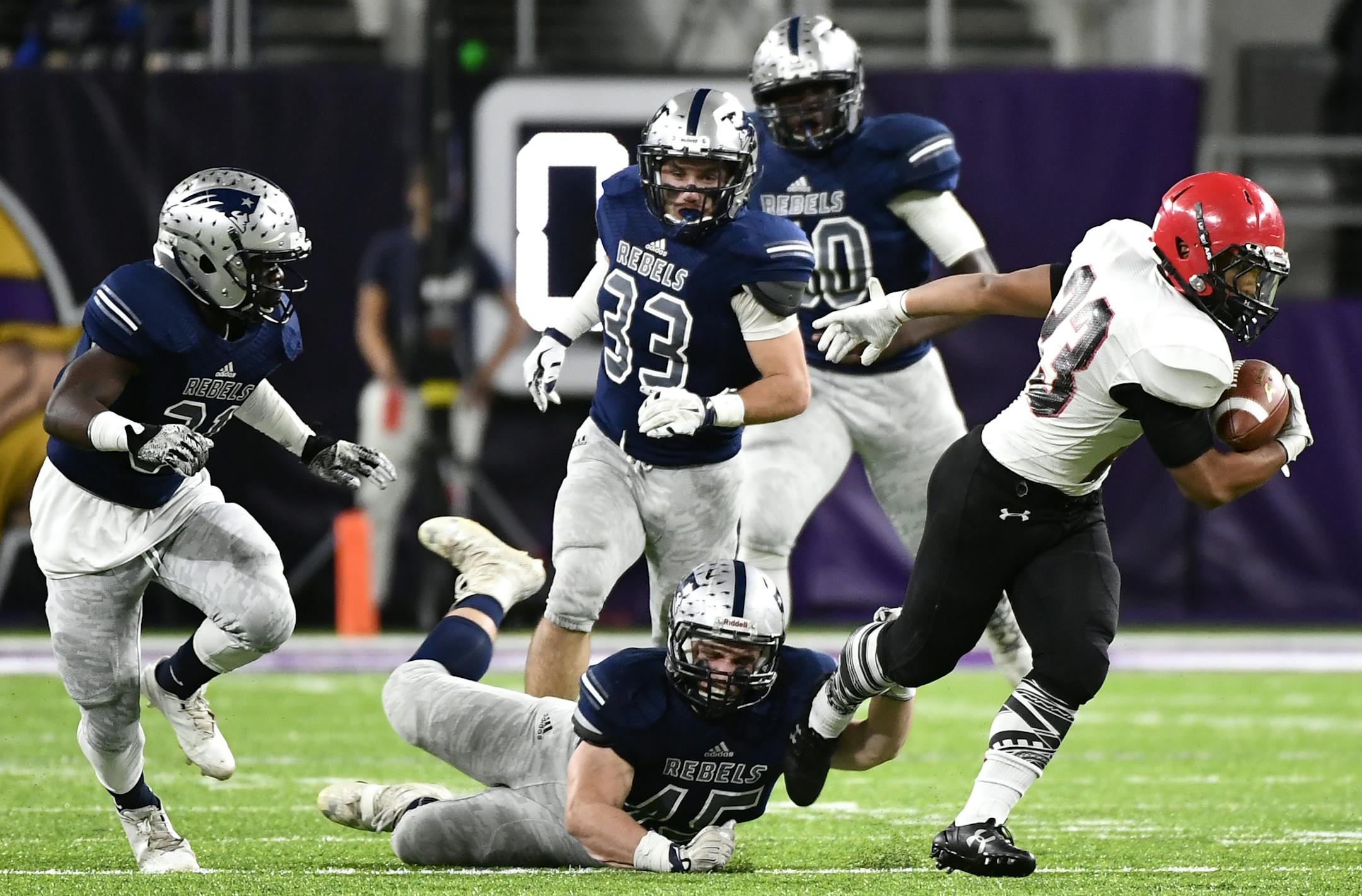 Eden Prairie running back Solo Falaniko (23) broke through a tackle by Champlin Park linebacker Colton Aydt (45) for a first down in the first quarter Friday. ] (AARON LAVINSKY/STAR TRIBUNE) aaron.lavinsky@startribune.com Eden Prairie played Champlin Park in a semifinal game of the state tournament on Friday, Nov. 18, 2016 at US Bank Stadium in Minneapolis, Minn.
