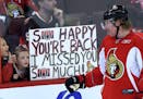 FILE - In a Sunday, Jan. 13, 2013 file photo, Ottawa Senators team captain Daniel Alfredsson acknowledges two young fans who show their appreciation f