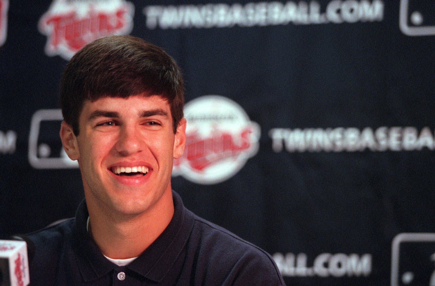 GENERAL INFORMATION: Twins press conference to announce the signing of No. 1 overall draft pick Joe Mauer, a Cretin-Derham Hall grad who will head to the club's Elizabethtown Rookie League IN THIS PHOTO: Joe Mauer, a Cretin-Derham Hall grad smiles at a Twins press conference at the Metrodome in Minneapolis on Wednesday after signing a contract with the Twins. Mauer, will head to the club's Elizabethtown Rookie League in Tennessee. ORG XMIT: MIN2013041718222050