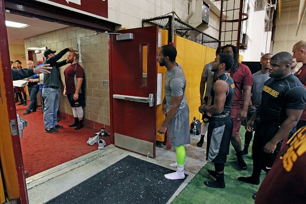 University of Minnesota players waited their turn to be measured during Pro Day at the Nagurski building on campus, Monday, March 2, 2015. Professiona
