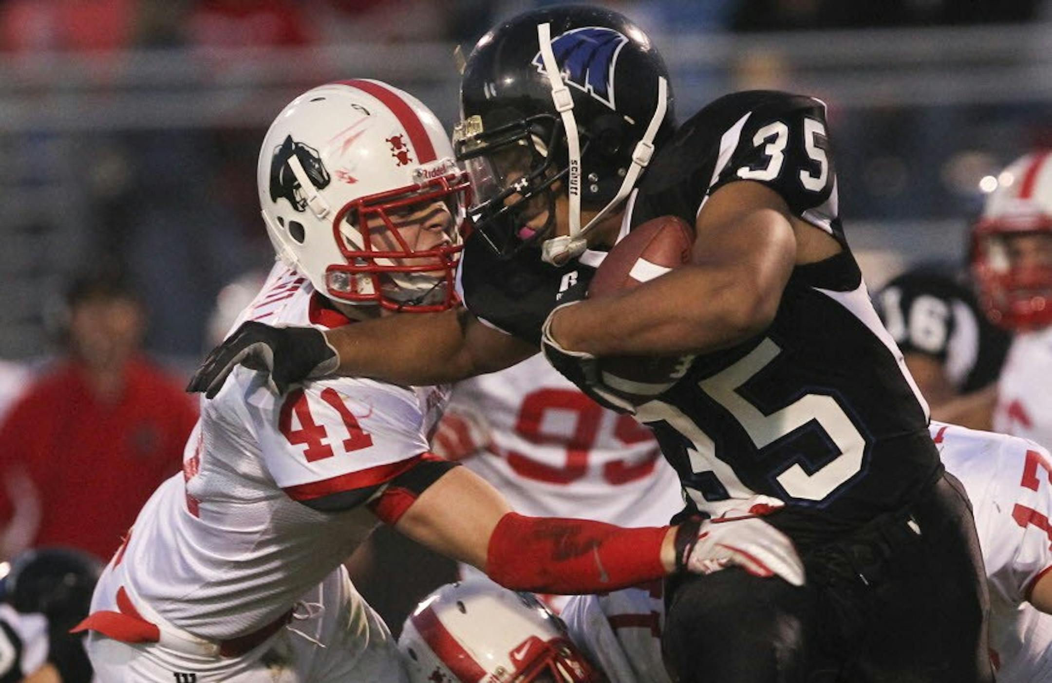 Eastview running back Will Rains shed a tackle attempt by Lakeville North's Jesse Cardena when the teams met Sept. 14 in Apple Valley. North won the South Suburban Conference matchup 24-7. Both teams are still alive in the playoffs. Photo: David Joles • djoles@startribune.com