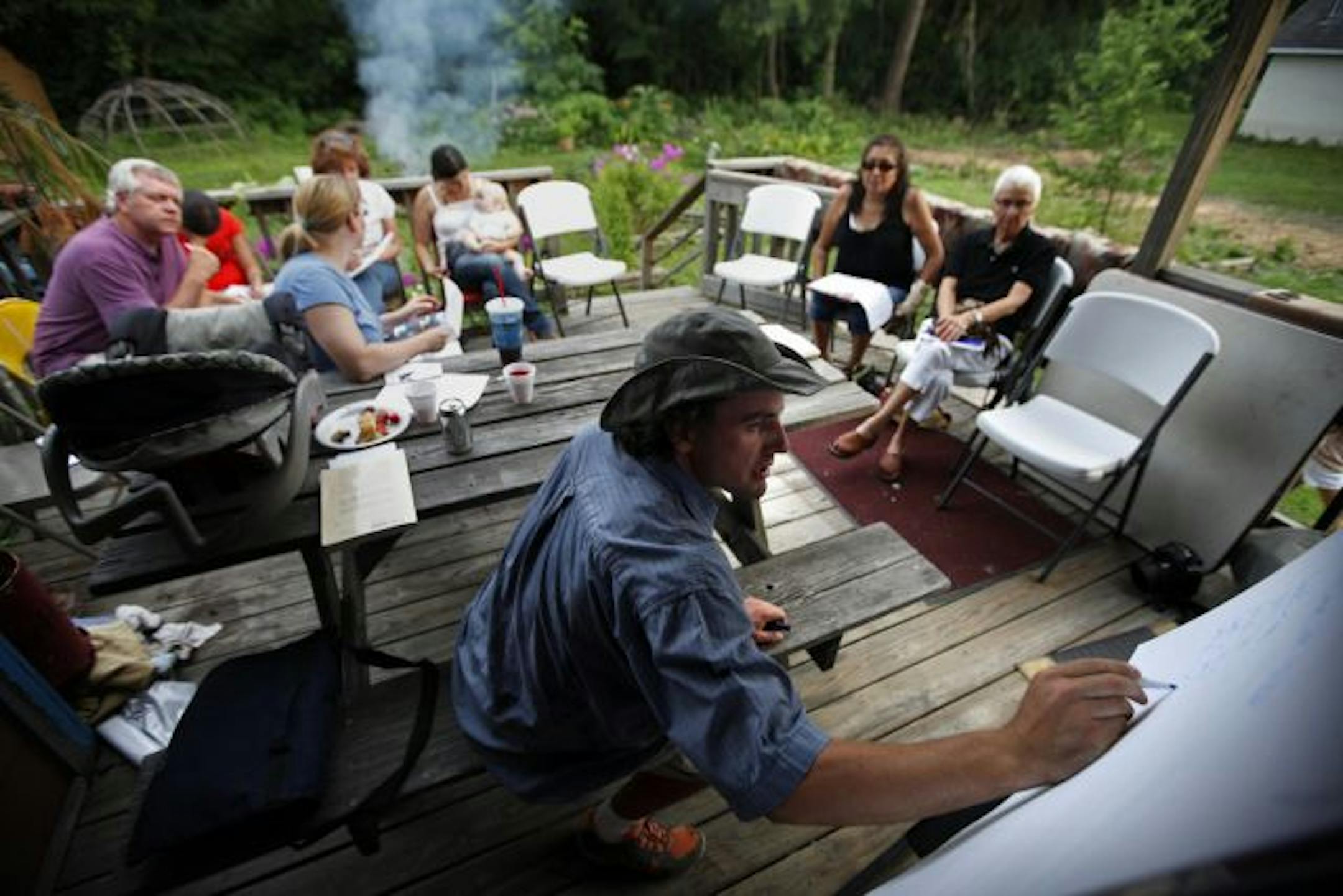 Brian Nackerud works with the informal class on the back porch of the Mendota Mdewakanton Dakota Community Center in Mendota on a warm summer evening.