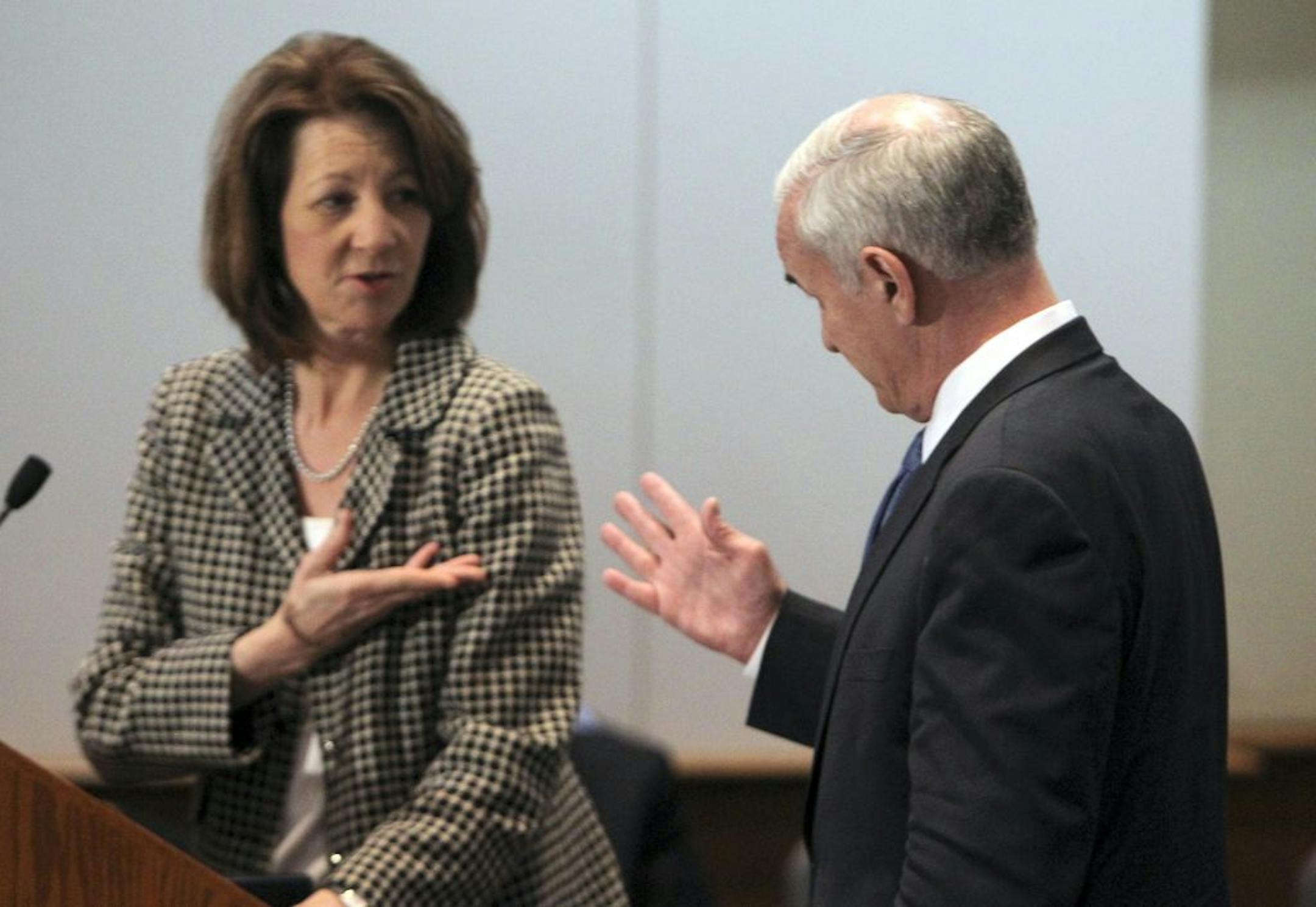 Lucinda Jesson, head of the Department of Human Services (right), and Gov. Mark Dayton