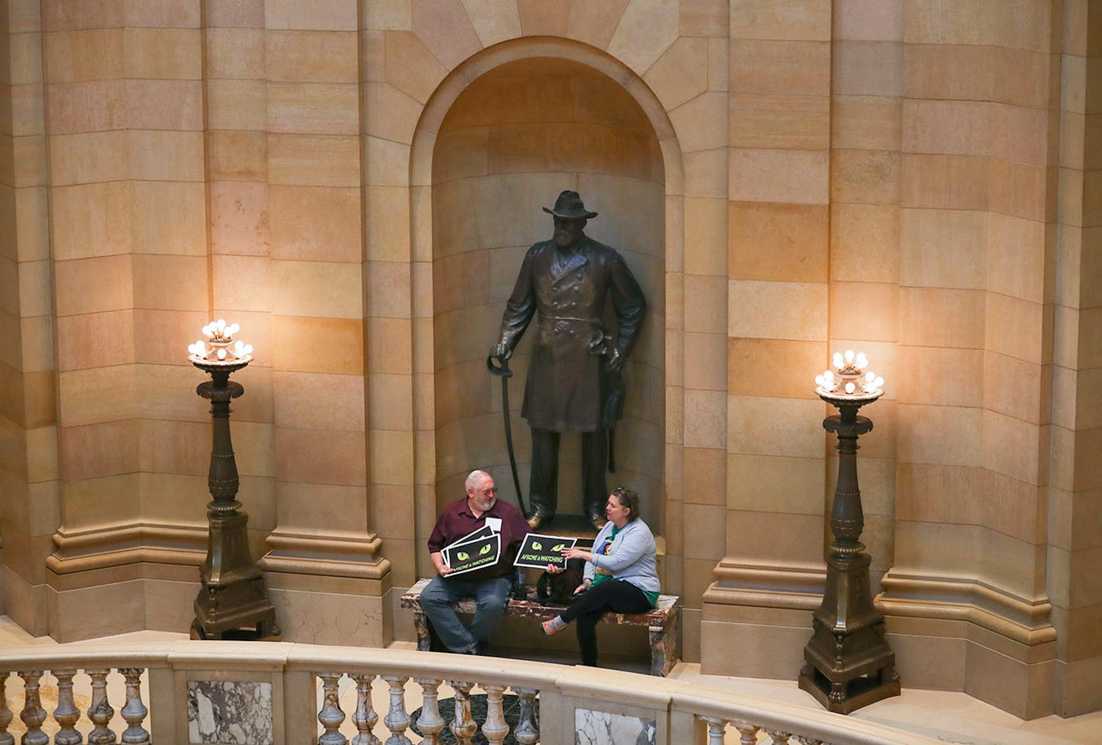 Spectators in the rotunda of the State Capitol on the final day of the legislative session Monday afternoon.