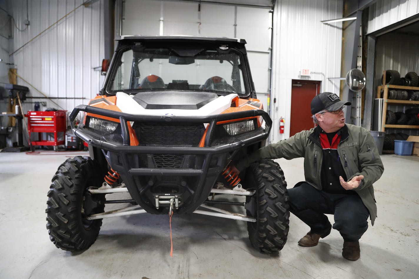 Randy Knadle, service manger at Cannon Power Sports Inc., looked over a Polaris ATV General 1000 that has been recalled in 2017. (JERRY HOLT/Star Tribune file photo)