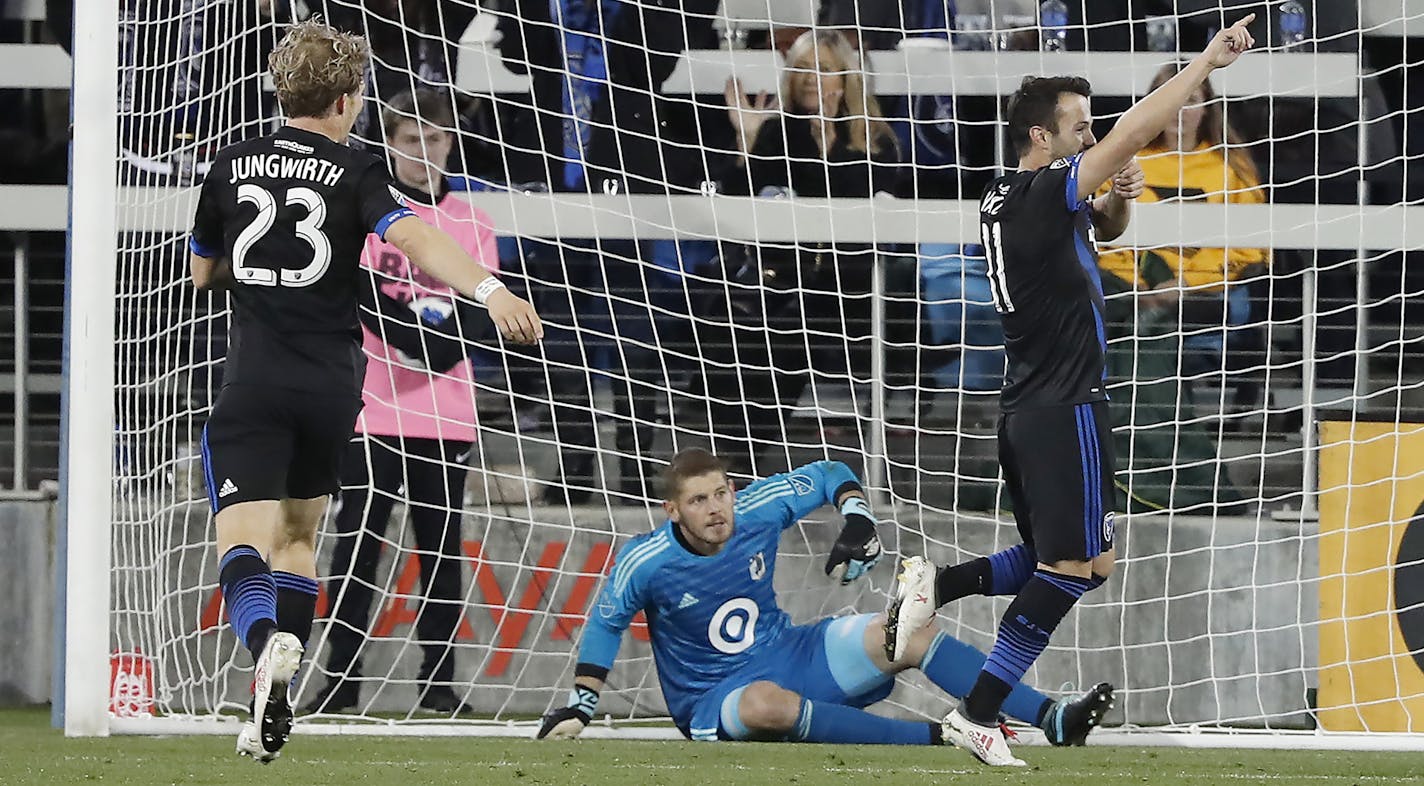 San Jose Earthquakes midfielder Vako, right, celebrates after scoring a goal past Minnesota United goalkeeper Matthew Lampson, center, during the first half of an MLS soccer match in San Jose, Calif., Saturday, Mar 3, 2018. (AP Photo/ Tony Avelar) ORG XMIT: MIN1803032238034093