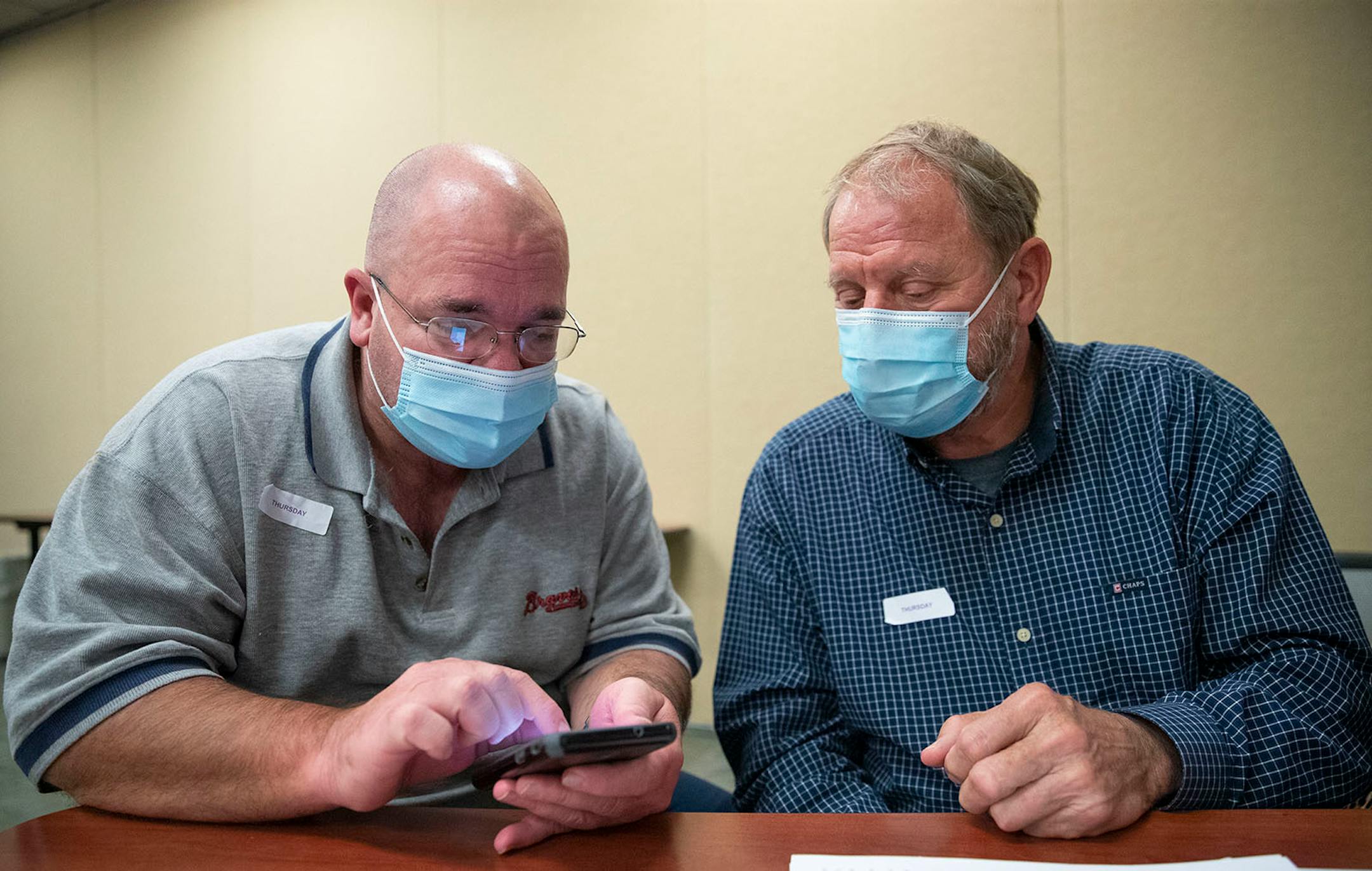 (Left) Tim White and Bob Schlicht exchanged phone numbers after their meeting at Essentia Health-St. Mary's Medical Center in Duluth on Friday October 16, 2020.