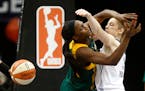 Lynx Lindsay Whalen blocked the shot of Seattle's Crystal Langhorne during the first half.