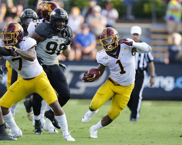 Minnesota running back Rodney Smith (1) runs against Purdue during the second half of an NCAA college football game in West Lafayette, Ind., Saturday,