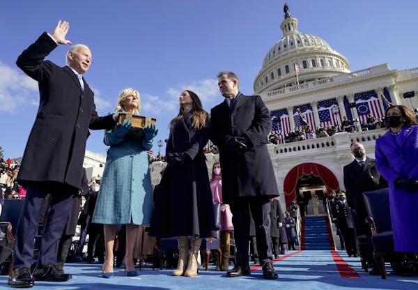 From left, President Joe Biden is joined by his wife, Jill Biden; daughter Ashley Biden; and son Hunter Biden as he takes the oath of office at the U.