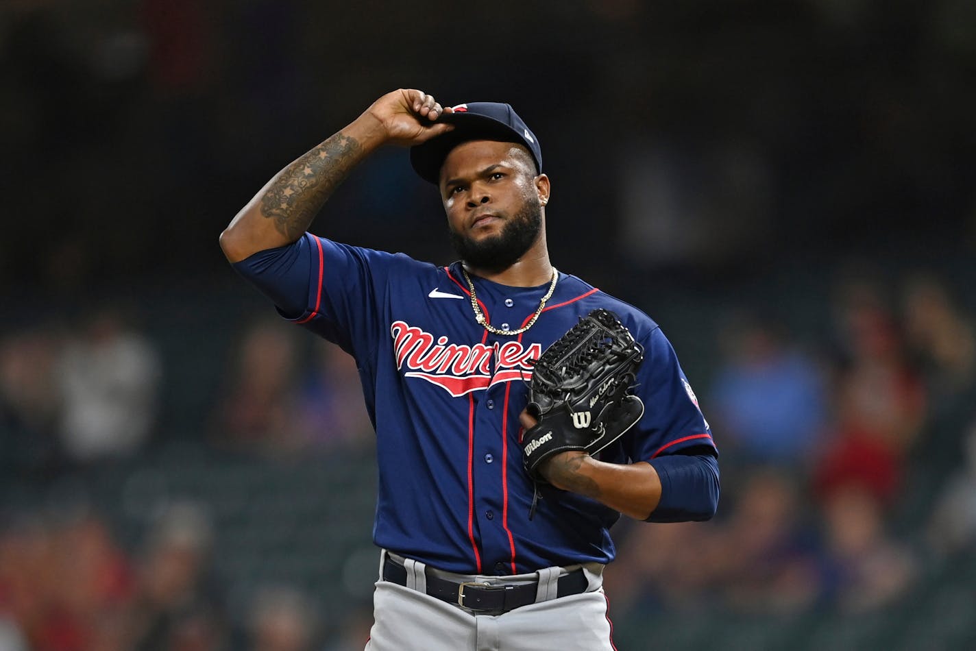 Minnesota Twins relief pitcher Alex Colome (48) reacts after throwing a ball in the eighth inning of a baseball game against the Cleveland Indians, Tuesday, April 27, 2021, in Cleveland. (AP Photo/David Dermer)