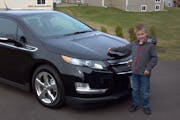 Wade Barisoff’s son Cailer, 6, shows off his dad’s Chevrolet Volt.