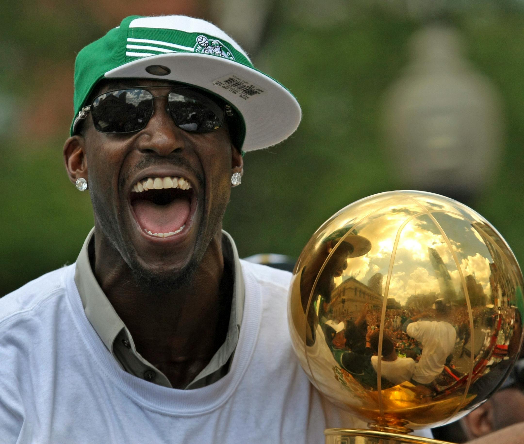 Kevin Garnett of the Boston Celtics holds the NBA Championship Trophy during the Boston Celtics Victory Parade on June 19, 2008 in Boston, Massachusettes.