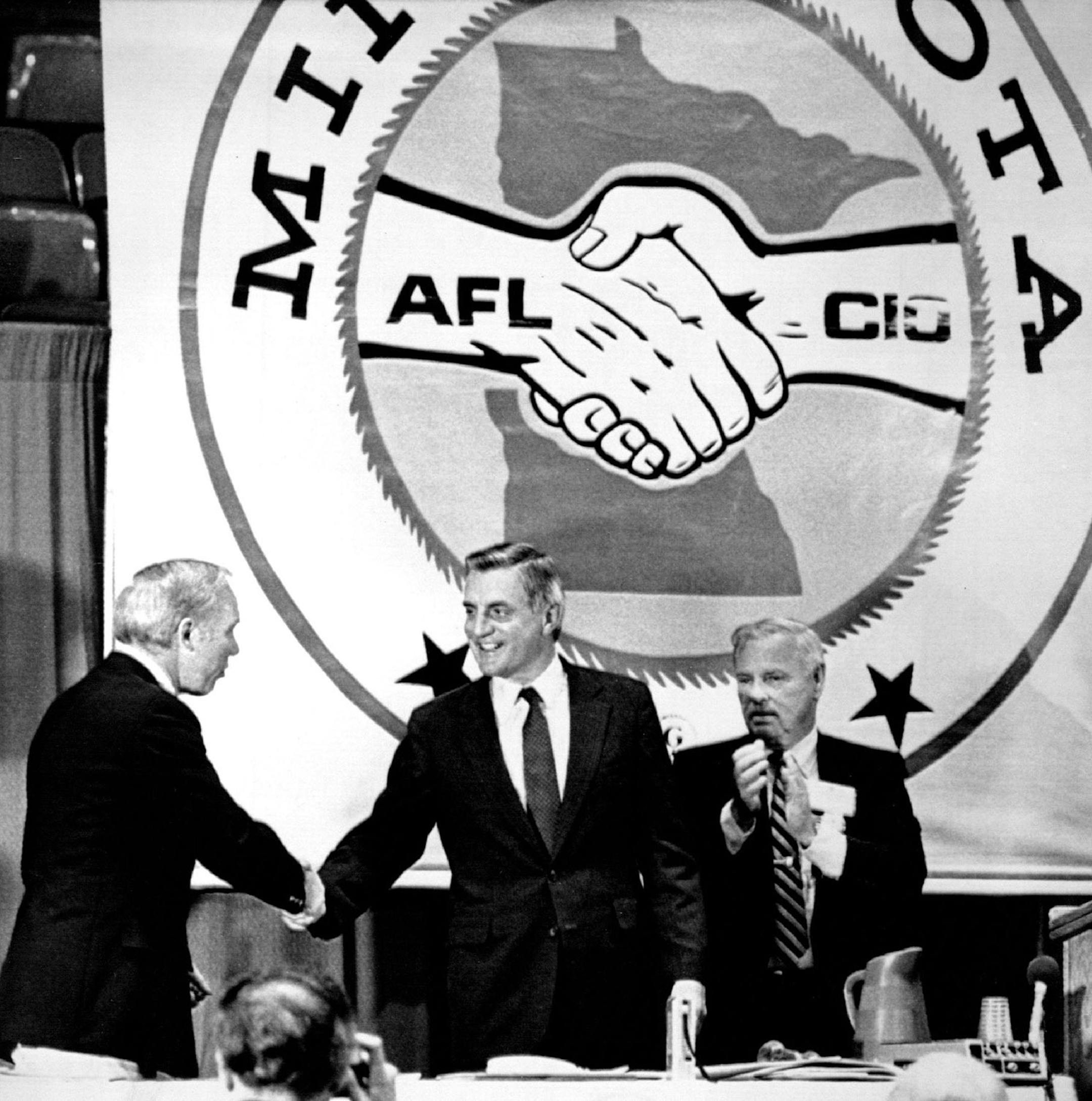 September 20, 1982 Convention - U.S. Rep. James Oberstar, Minn., (left) pumps the hand of former Vice President Walter Mondale while AFL-CIO President David Roe looks on at the AF-CIO state convention in Duluth Monday. September 22, 1982 CC, AP Laserphoto