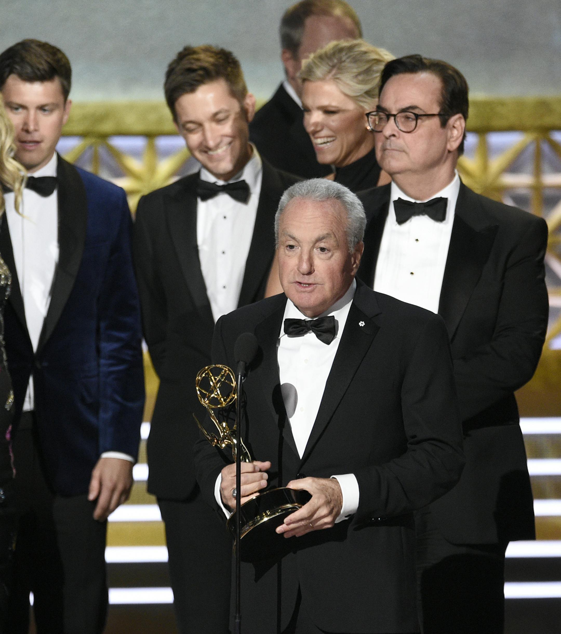 Lorne Michaels and the cast of SNL accept the award for outstanding variety sketch series for "Saturday Night Live" at the 69th Primetime Emmy Awards on Sunday, Sept. 17, 2017, at the Microsoft Theater in Los Angeles. (Photo by Chris Pizzello/Invision/AP)