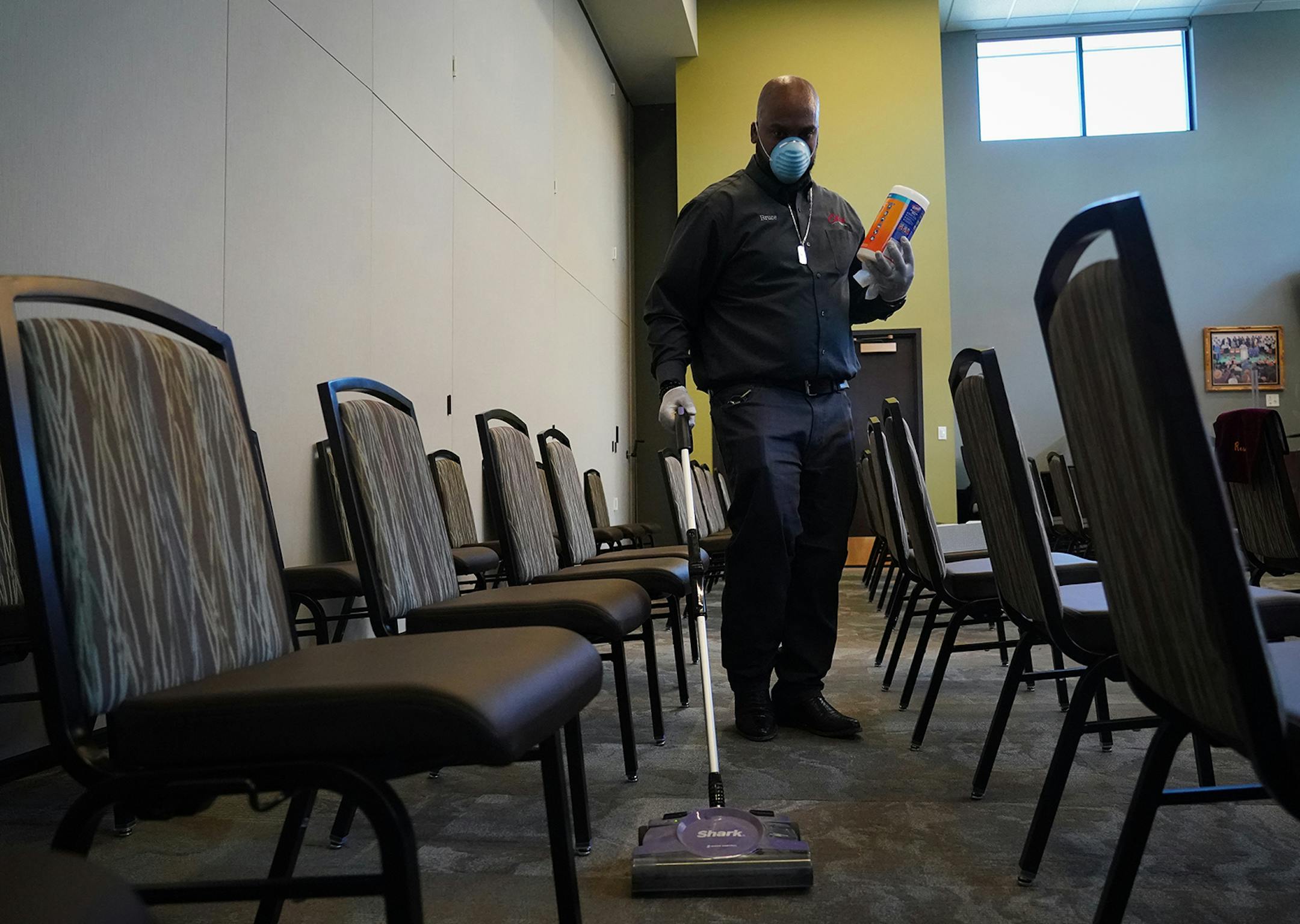 Estes Funeral Chapel CFO and directors assistant Bruce DeArmon, Sr. vacuumed and disinfected a chapel between memorial services. Estes Funeral Home in Minneapolis is taking extra precautions during the COVID-19 breakout, including extra cleaning between memorial services. Since 2018, Estes has been wired to provide livestreaming video which they encourage people to use to stay safe away from crowds and still feel part of their loved one's service.