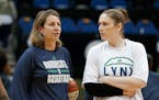 Minnesota Lynx head coach Cheryl Reeve, left, talks with Lindsay Whalen before Game 5 of the WNBA basketball finals against the Indiana Fever, Wednesd
