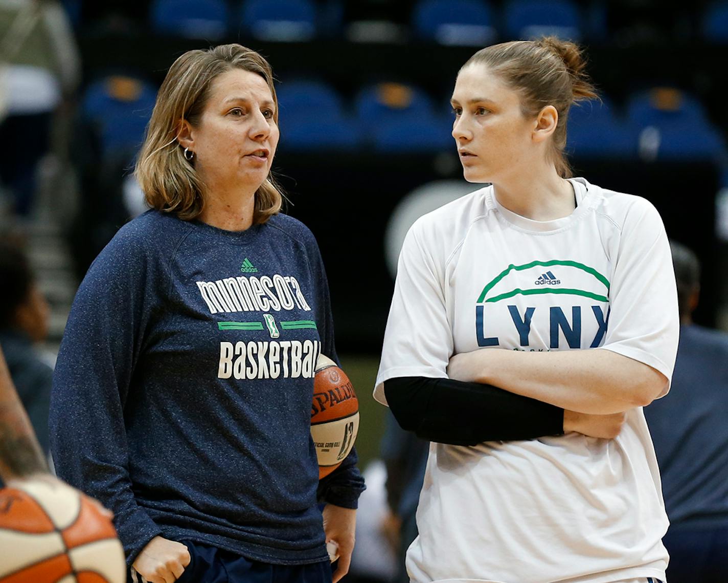 Minnesota Lynx head coach Cheryl Reeve, left, talks with Lindsay Whalen before Game 5 of the WNBA basketball finals against the Indiana Fever, Wednesday, Oct. 14, 2015, in Minneapolis.