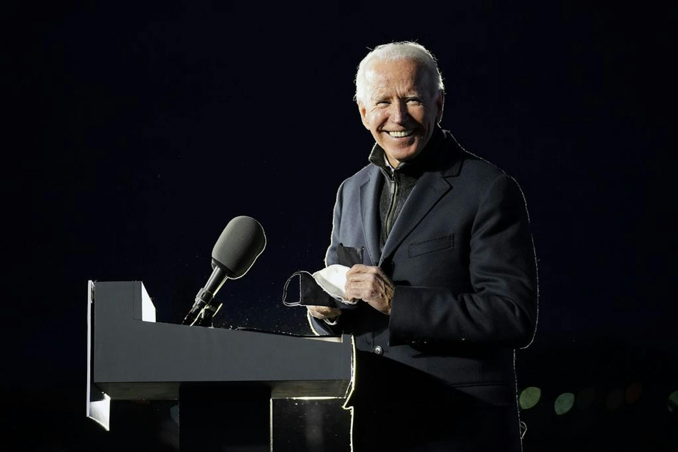 Democratic presidential candidate former Vice President Joe Biden smiles as he arrives to speak at a drive-in rally at Lexington Technology Park, Monday, Nov. 2, 2020, in Pittsburgh. Biden defeated President Donald Trump to become the 46th president of the United States on Saturday, Nov. 7, positioning himself to lead a nation gripped by historic pandemic and a confluence of economic and social turmoil.