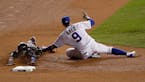 Chicago Cubs second baseman Javier Baez tags out Cleveland Indians' Francisco Lindor during the sixth inning of Game 5 of the Major League Baseball Wo