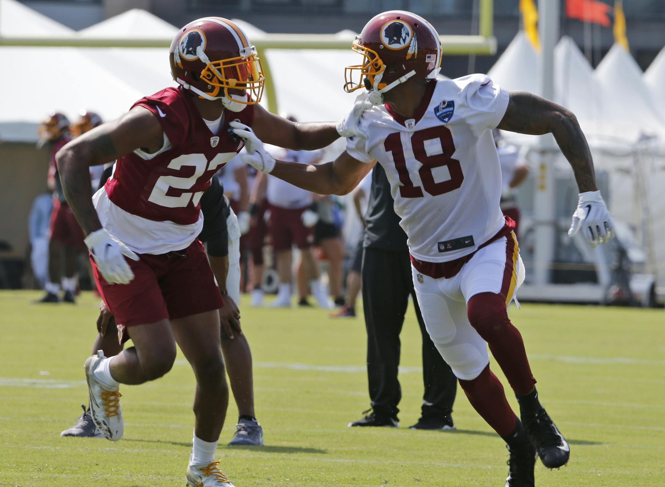 Josh Doctson (18) runs a route during training camp this summer.