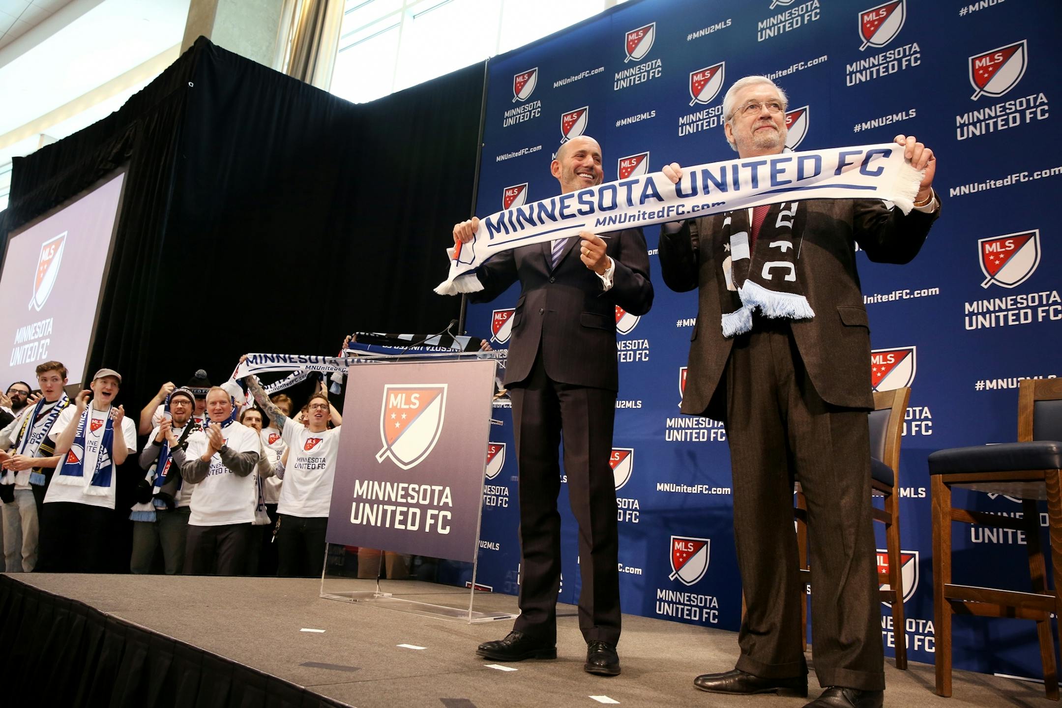 Major League Soccer Commissioner Don Garber, left, and Dr. Bill McGuire announce that Minnesota United FC will move to MLS at Target Field in Minneapolis on Wednesday, March 25, 2015.