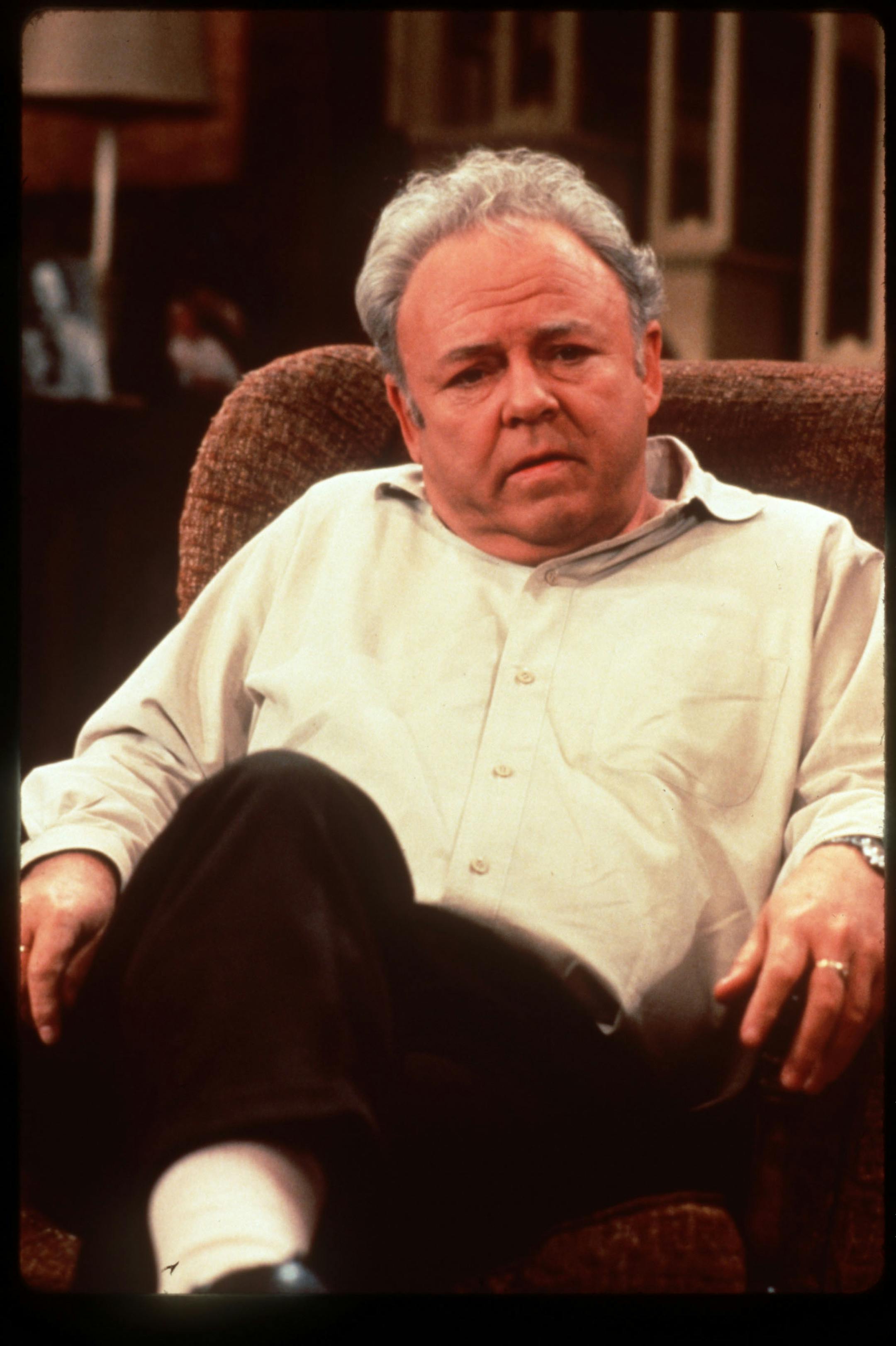 Carroll O'Connor is shown in his famous role as Archie Bunker in the television show "All In The Family." The original credit is CBS Television. Cutline in newspaper says TV Land/ Paramount.