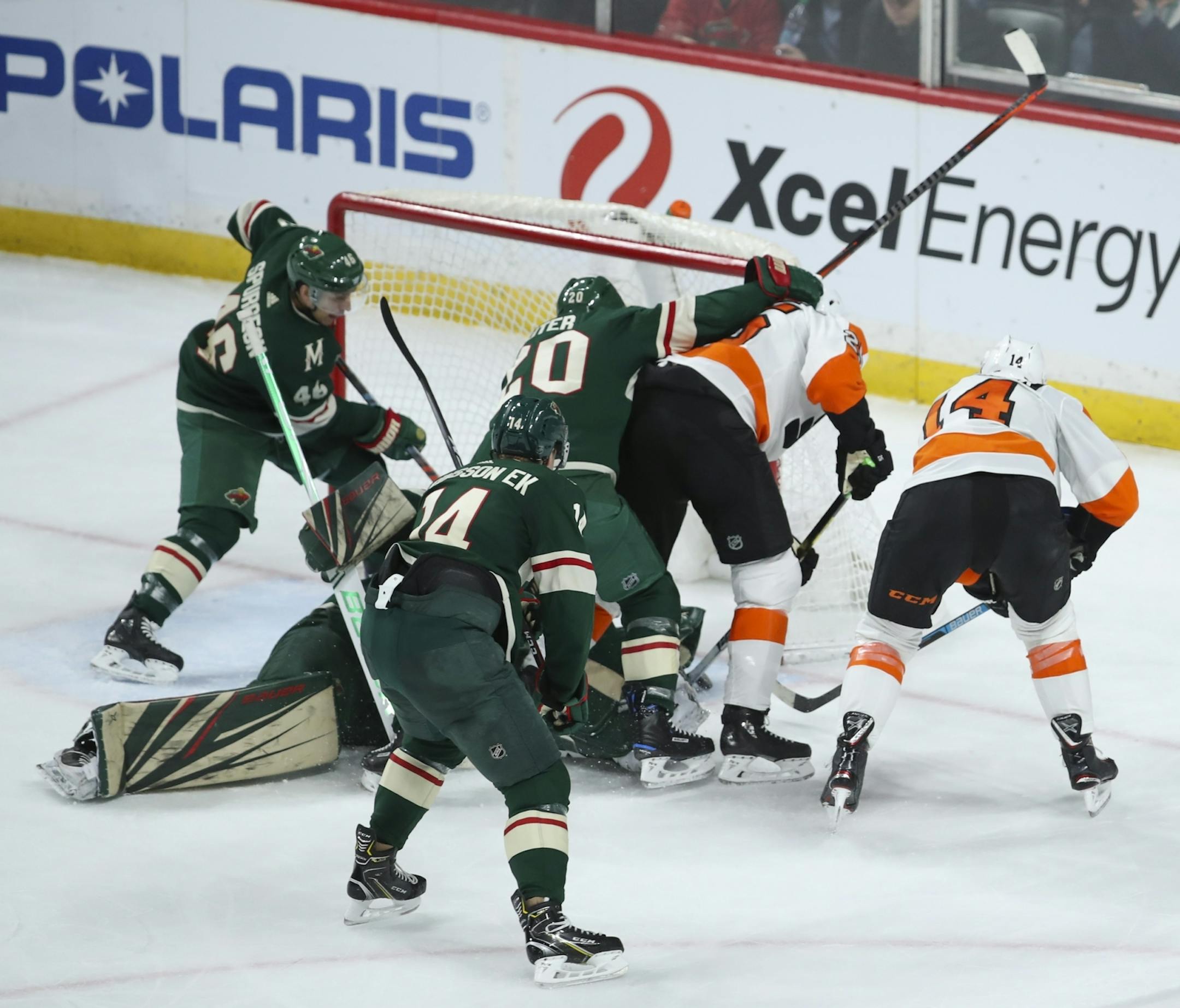 With Minnesota Wild defenseman Ryan Suter (20) defending from behind, Philadelphia Flyers left wing James van Riemsdyk (25) guided the puck past Minnesota Wild goaltender Devan Dubnyk (40) for the winning goal in the third period.